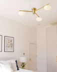 Floating Arm Globe Ceiling Lamp
